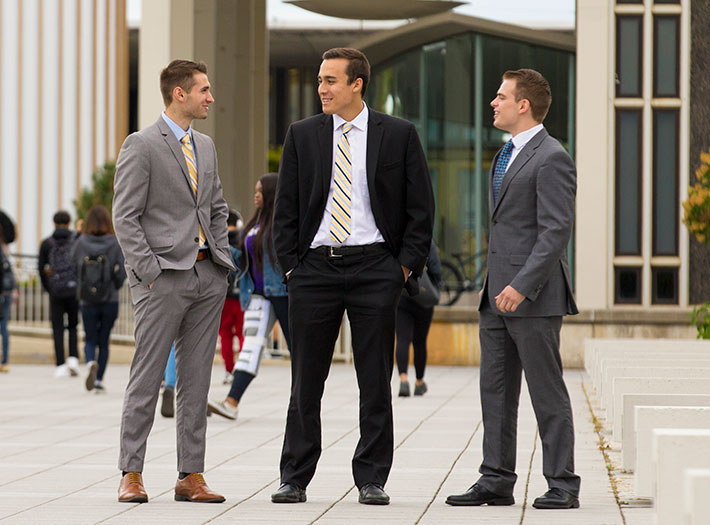 Business students chat outside on UAlbany campus