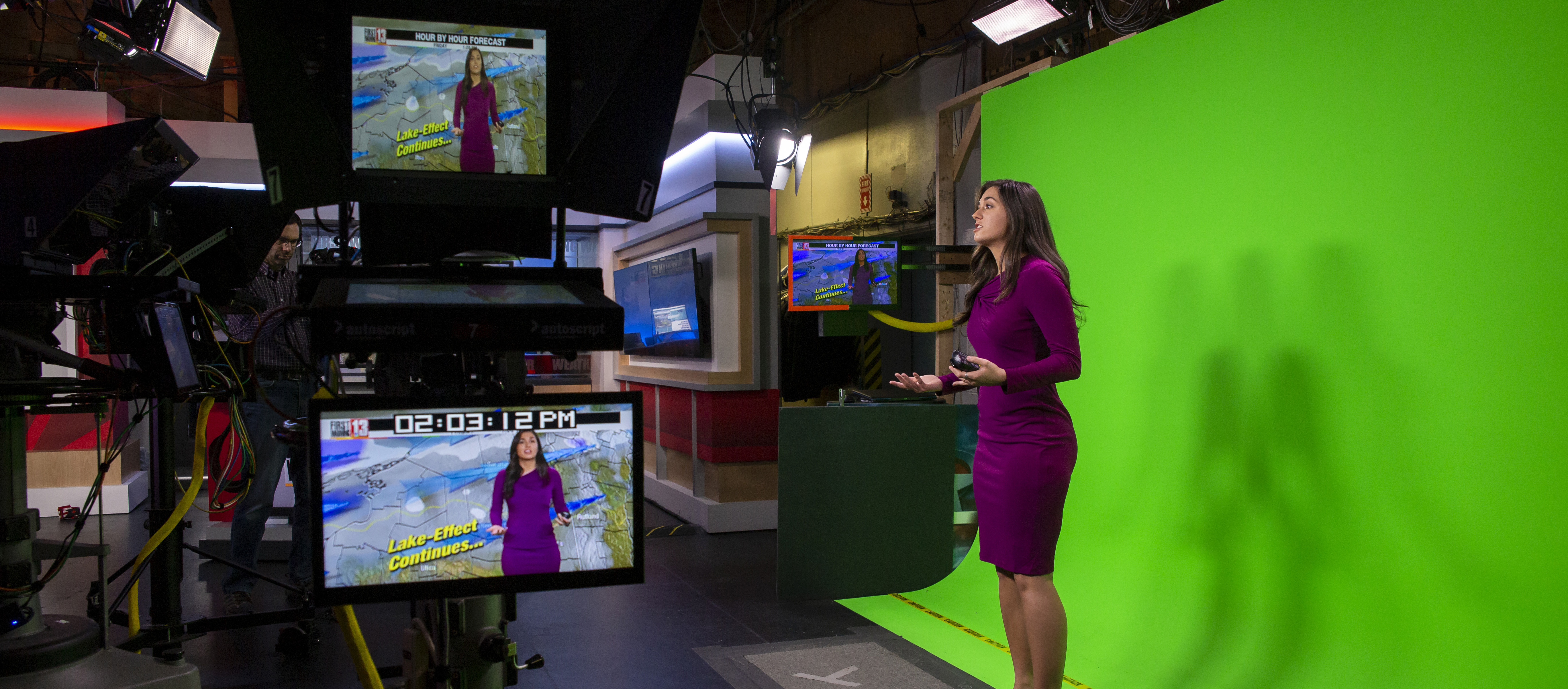 An Atmospheric and Environmental Sciences student interns as a weather broadcaster at WNYT. 