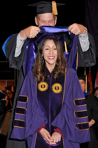 Michelle Mora being hooded at the UAlbany 2019 Doctoral Commencement Ceremony