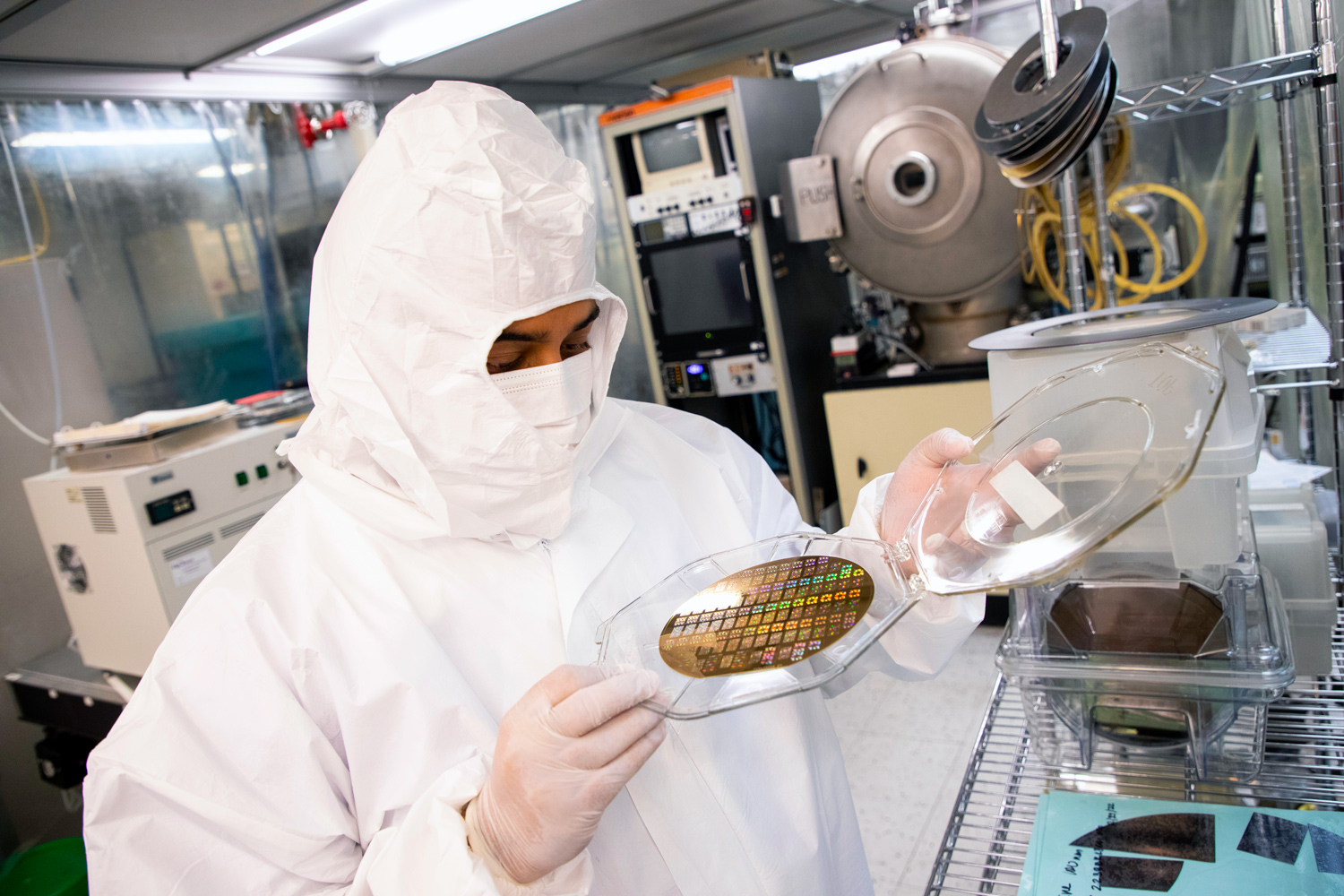 A researcher holding a wafer in a UAlbany nanotechnology lab.