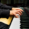 Hands playing on a Piano keyboard
