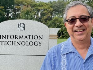 Jim Bole CISO stands in front of Information Technology sign outside