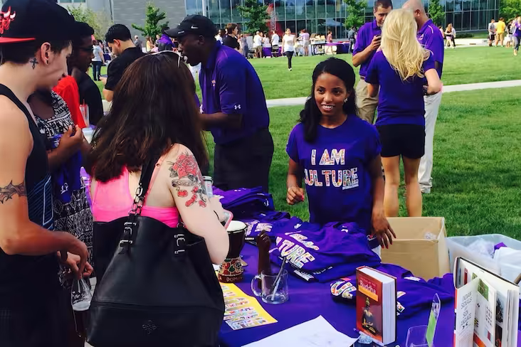 Students staff a table.