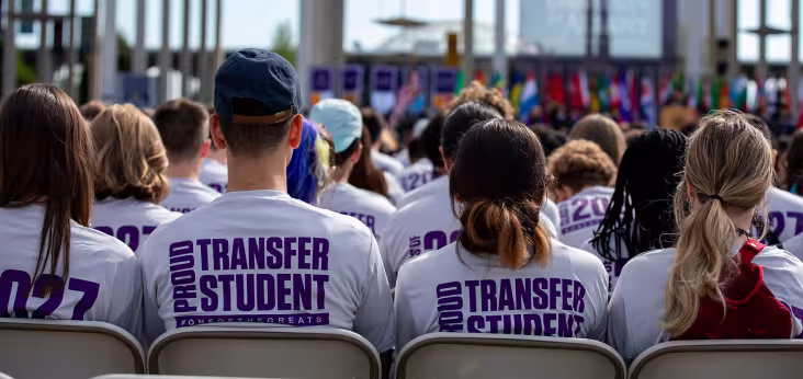 Students at convocation wearing Proud Transfer Student shirts.