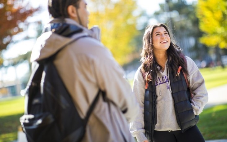 UAlbany student enjoys a sunny fall day with friend