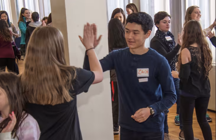 Students high-fiving