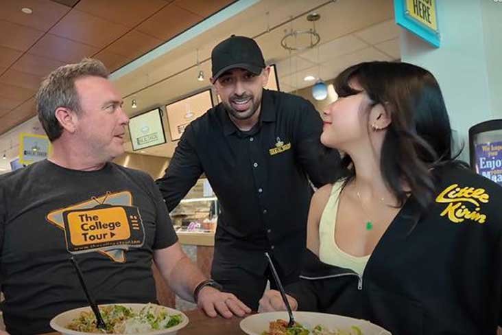 The owner of the Halal Shack speaking with the host of The College Tour and a UAlbany student.