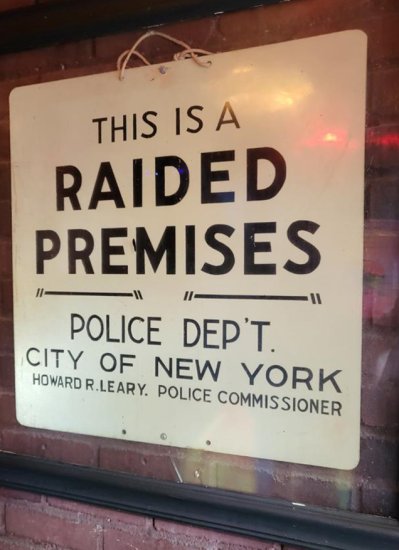 Sign reading, "This is a raided premises/ Police Dep't./ City of New York/ Howard R. Leary. Police Commissioner."