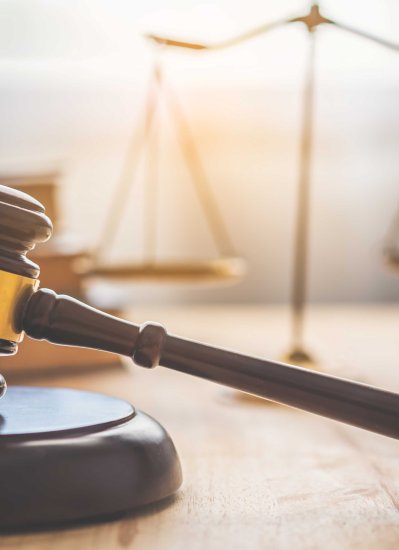 Image of a gavel on a desk.