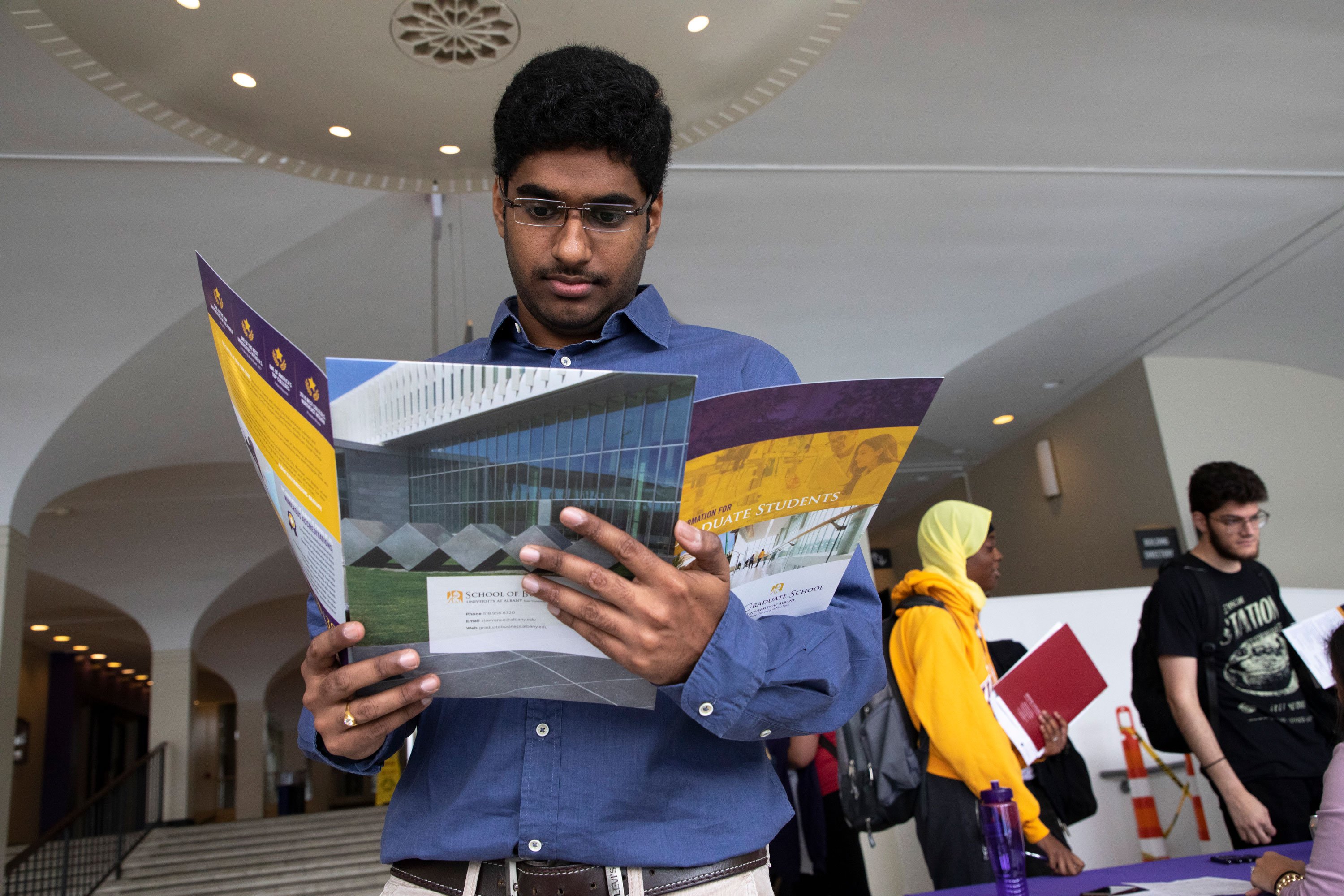 A student attends UAlbany’s annual Graduate & Professional School Fair on the Uptown Campus.