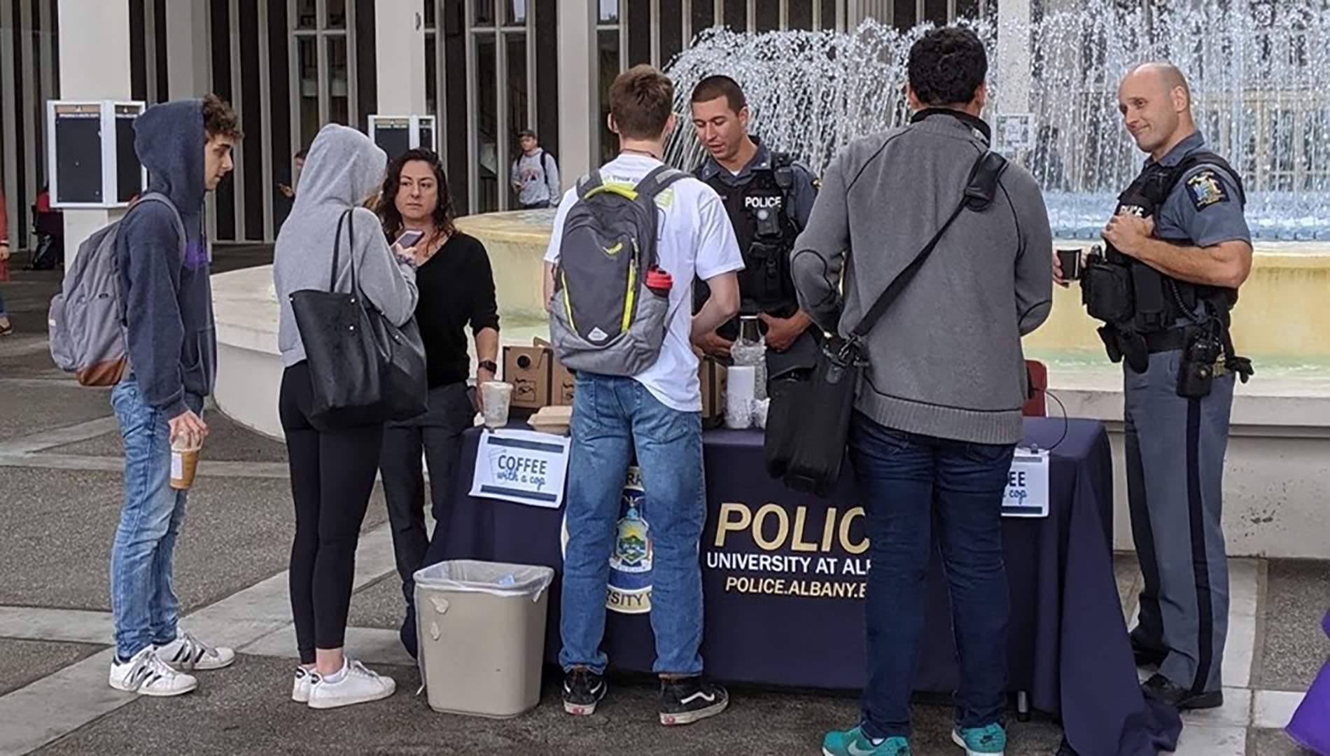 UPD Officers speak with students at Coffee with a Cop table event 
