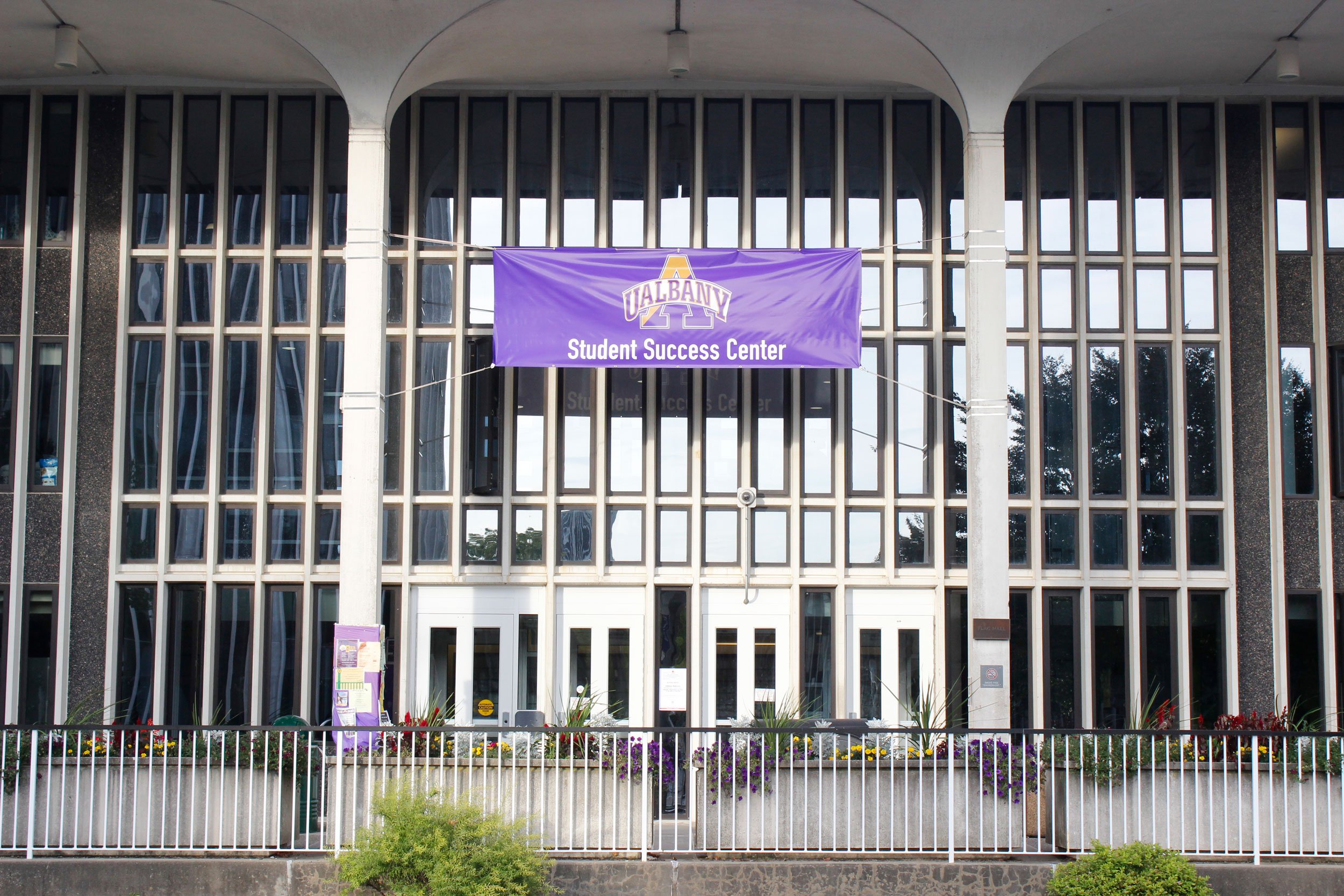 A banner for the Student Success Center hangs outside State Quad