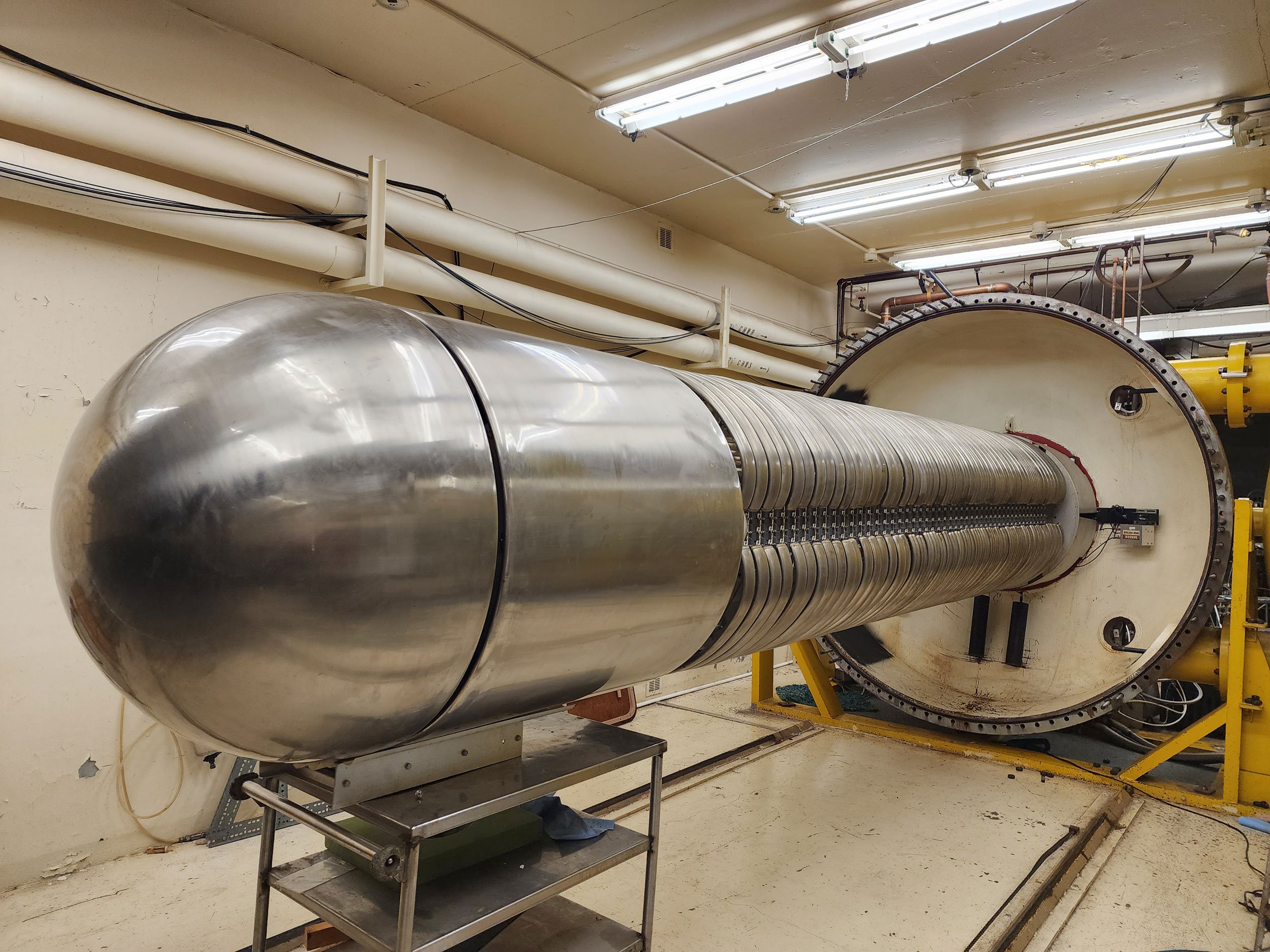 The inside of the RDI Dynamitron particle accelerator is a long metal tube made a several parts.