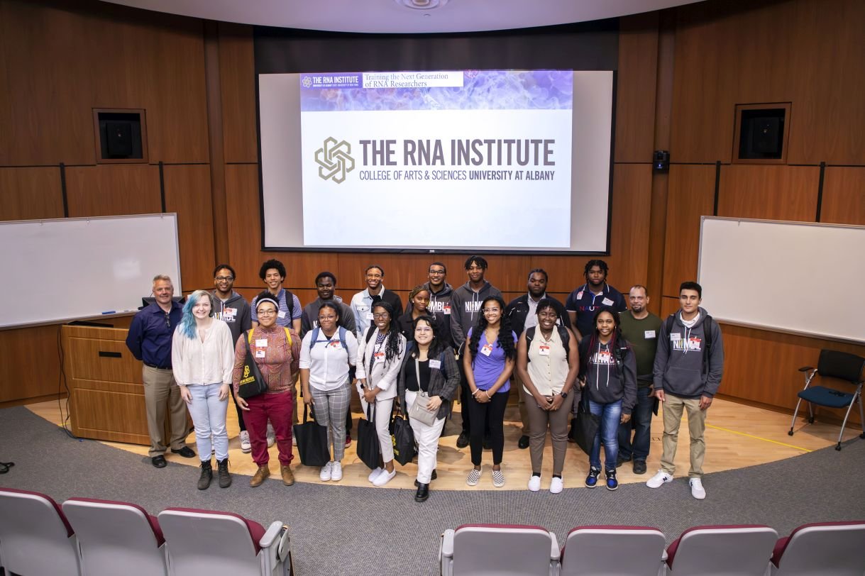 NIIMBL eXperience students pose for a group photo in the RNA Institute auditorium