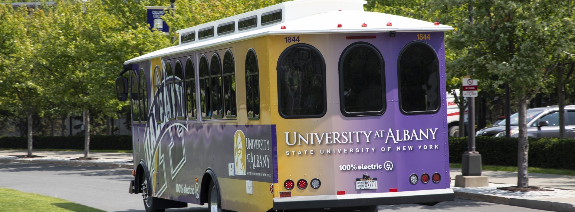 The UAlbany Trolley driving out of Collins Circle. 