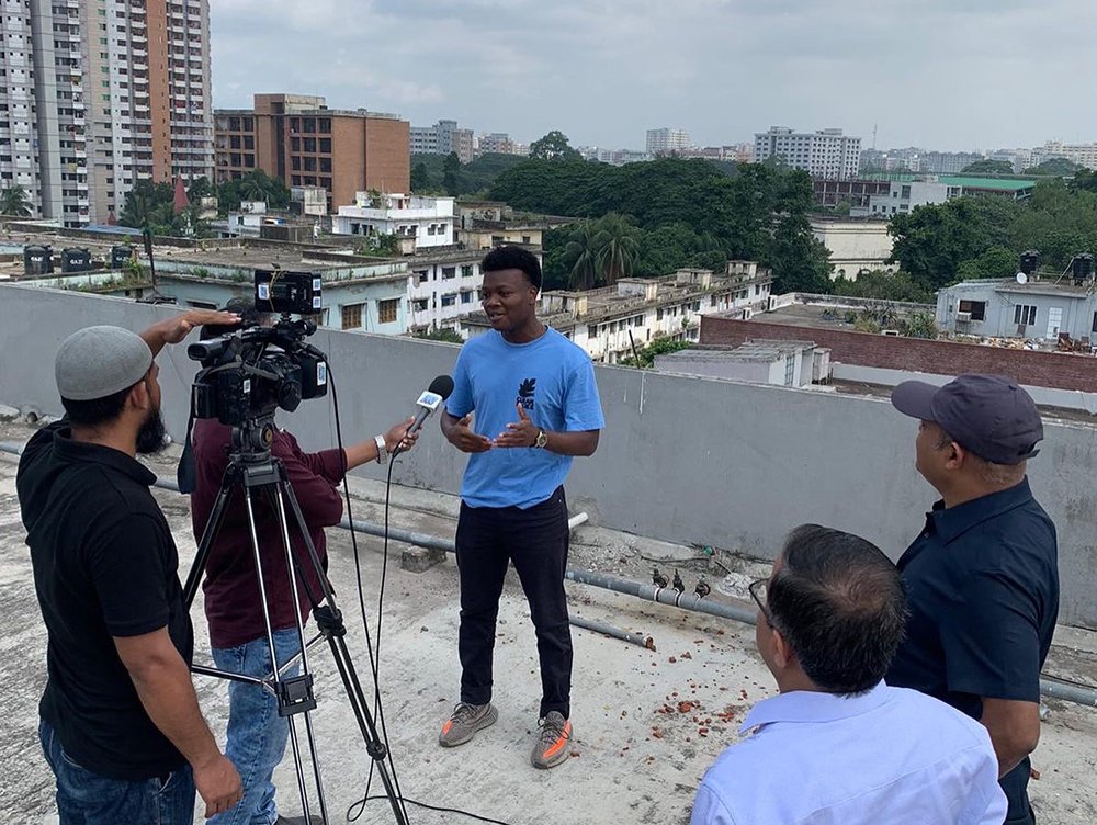 Marco Eugene meets with local press discussing his research on air quality in Dhaka, Bengladesh.