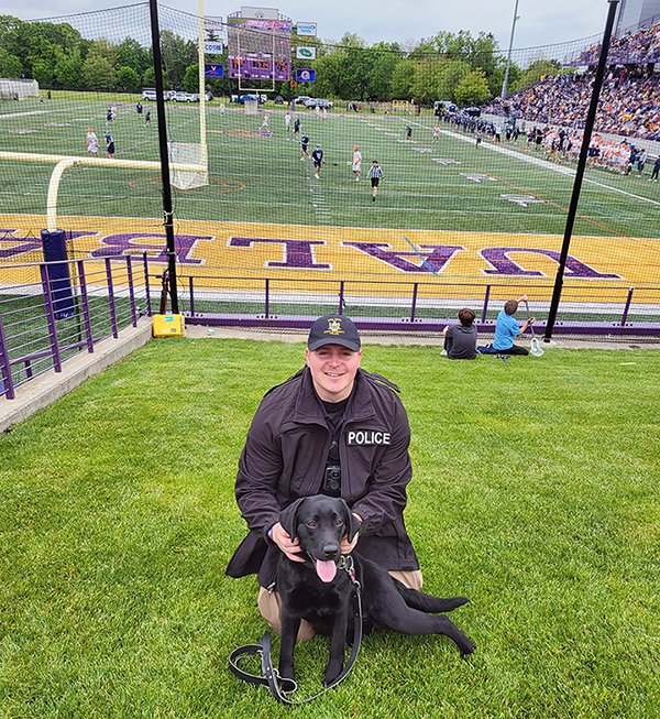 Roxy and Officer Faath attend a football game on opening weekend at Casey Stadium.