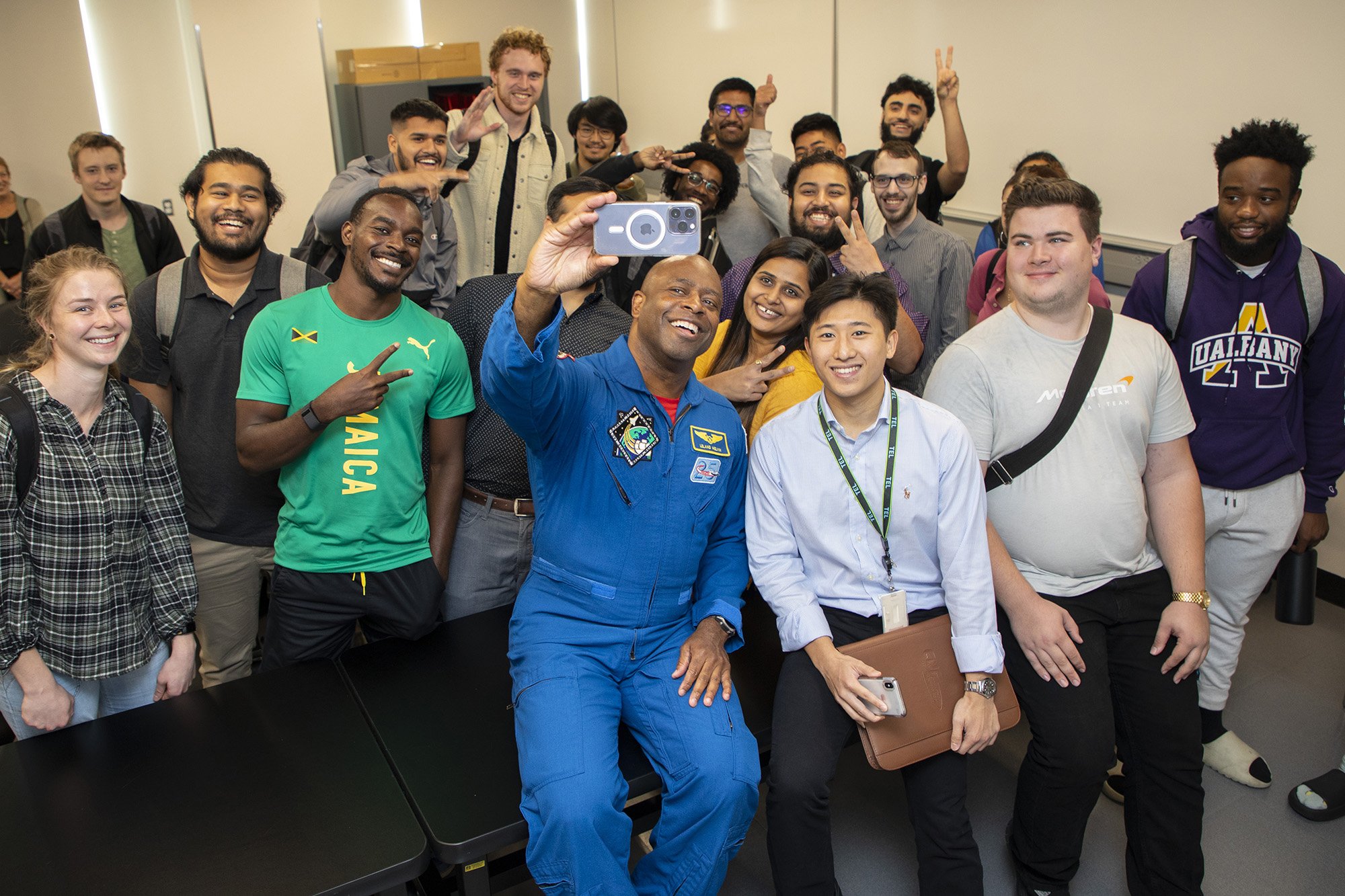 Former NASA Astronaut Leland Melvin takes a photo with students at the College of Nanotechnology, Science, and Engineering.