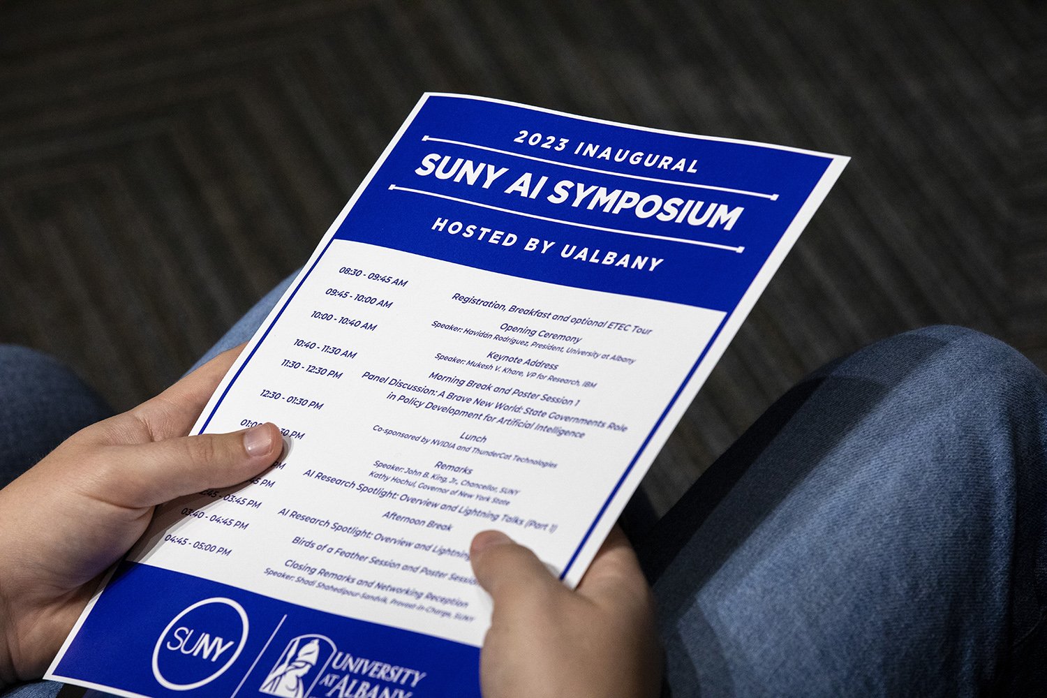 A brochure from the SUNY AI Symposium at ETEC. (Photo by Patrick Dodson)