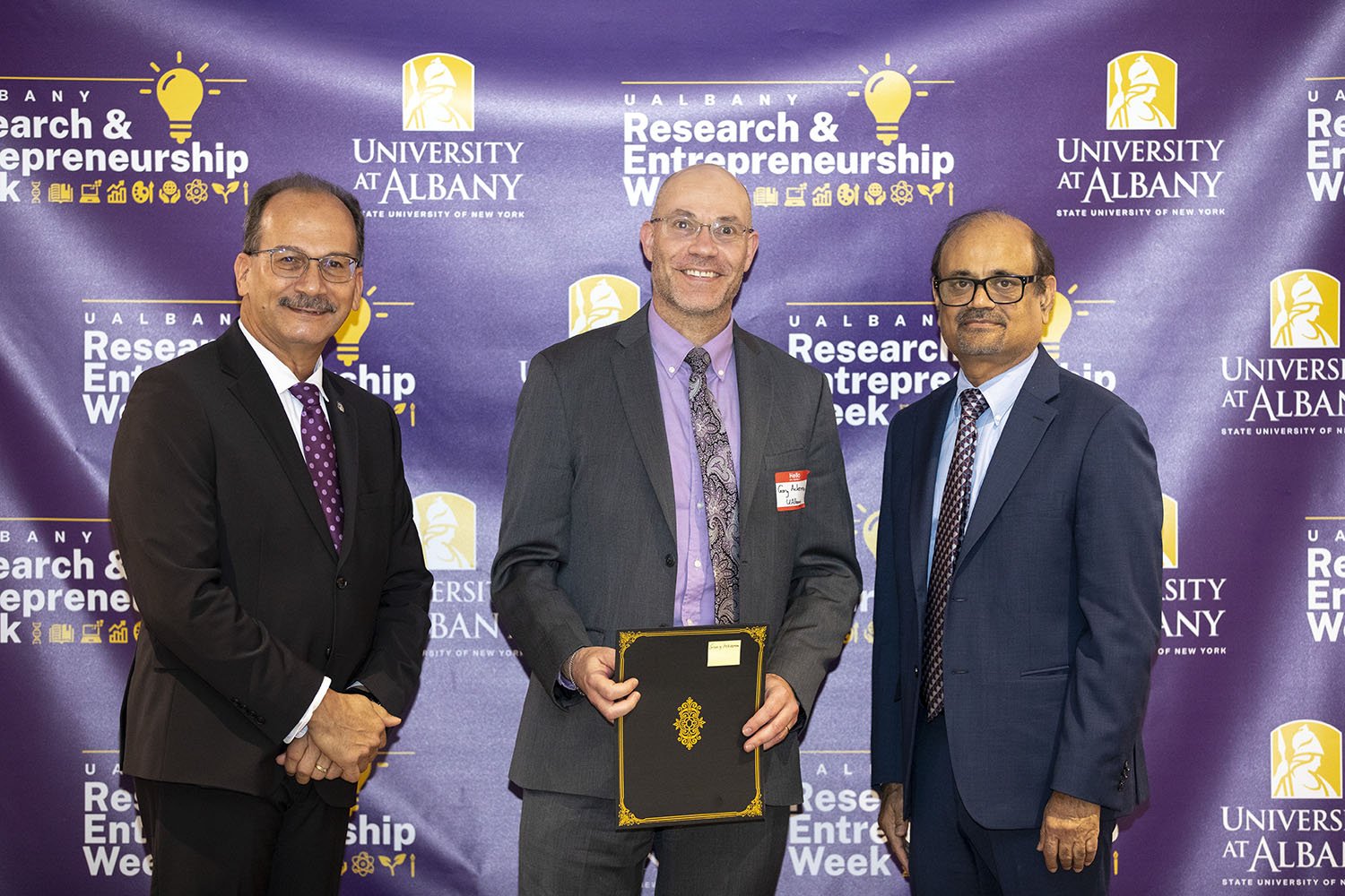 CEHC's Gary Ackerman with UAlbany President Havidán Rodríguez and Vice President for Research and Economic Development Thenkurussi “Kesh” Kesavadas.