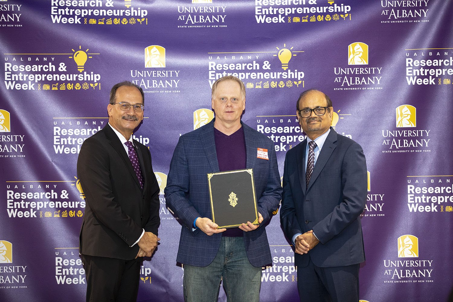 Scott Miller, ASRC, with UAlbany President Havidán Rodríguez and Vice President for Research and Economic Development Thenkurussi “Kesh” Kesavadas.