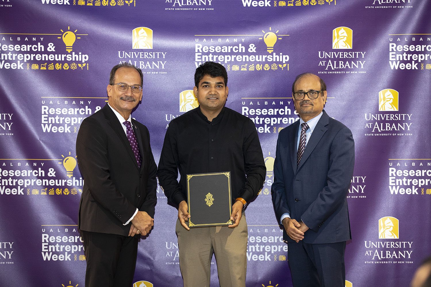 Subodh Mishra, The RNA Institute, with UAlbany President Havidán Rodríguez and Vice President for Research and Economic Development Thenkurussi “Kesh” Kesavadas.