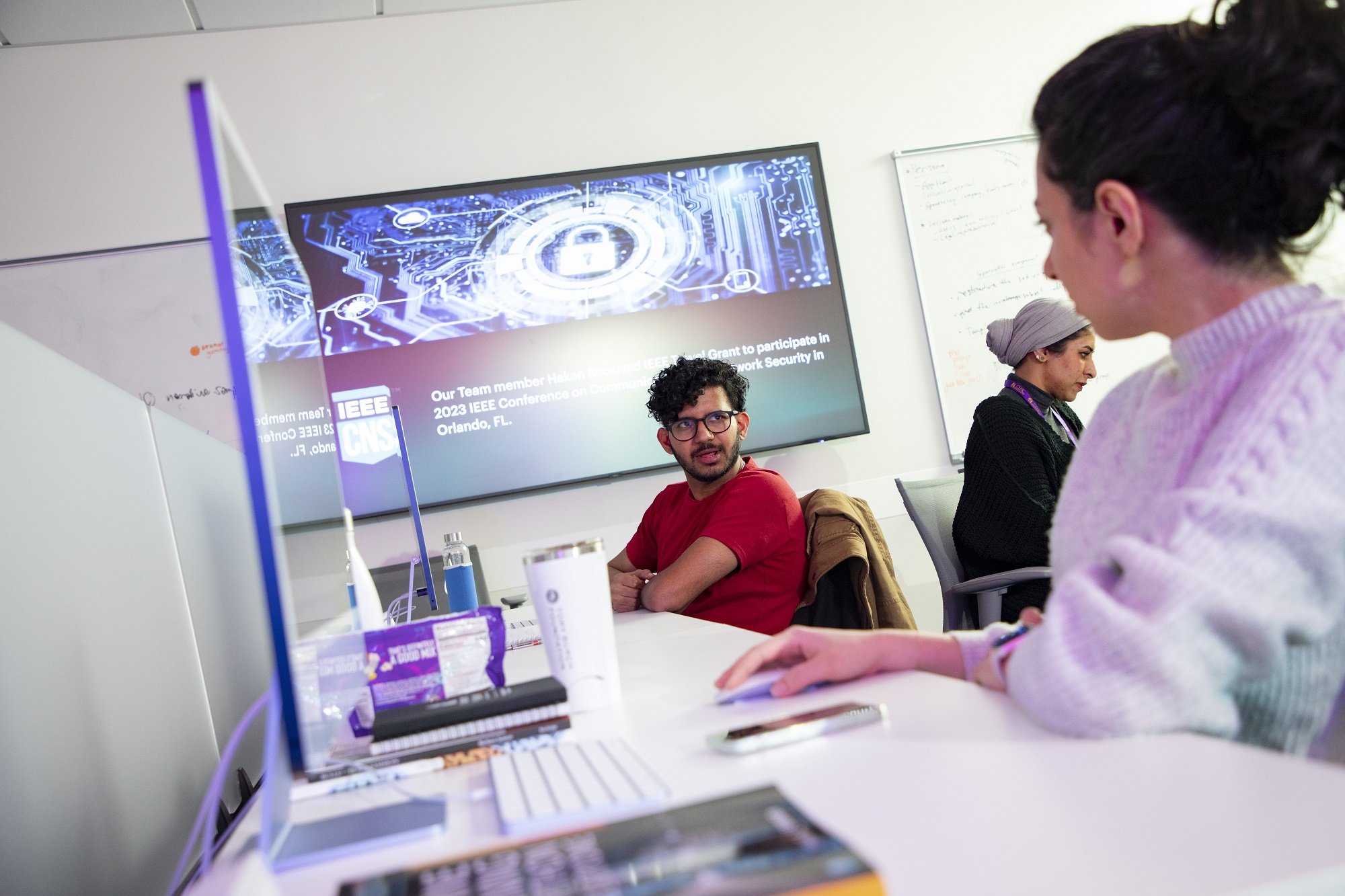 Students collaborate inside CEHC's AI in Complex Systems Laboratory.