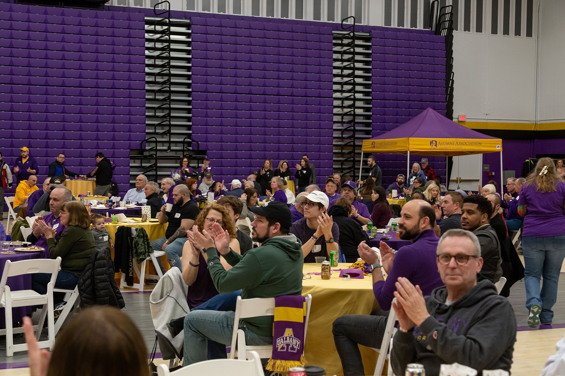 Fans celebrate at the 2024 Big Purple Growl and Ferocious Feast at the PE Gym.