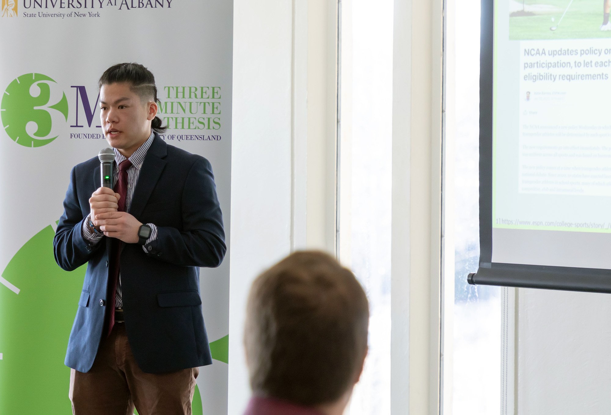 Alexander Perry, a doctoral student in sociology, presents at the 3-Minute Thesis finals.