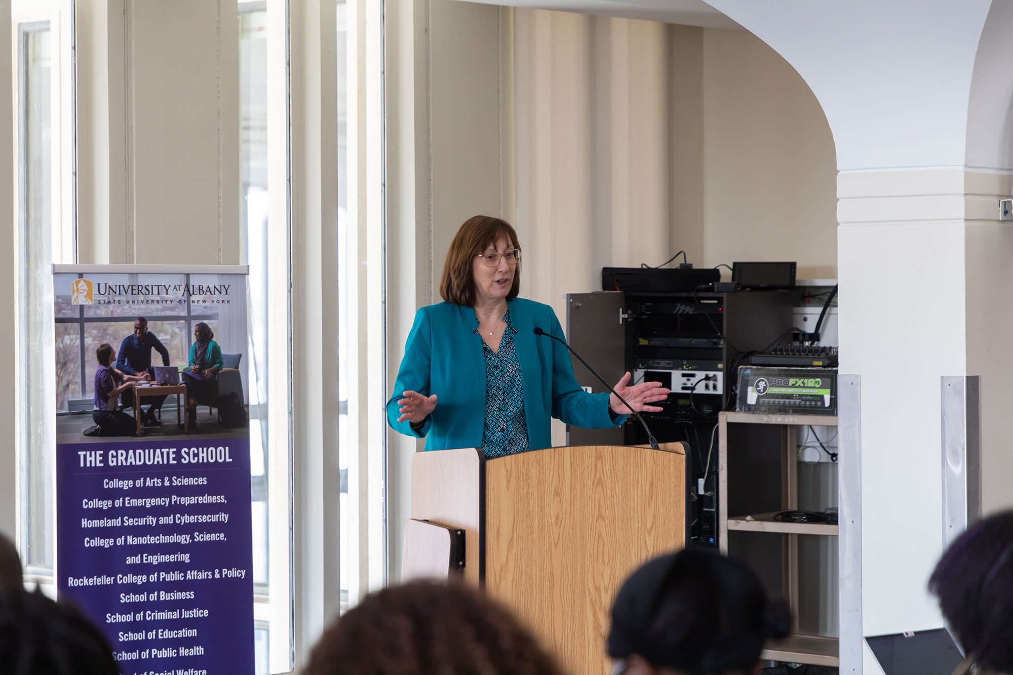 nterim Vice Provost and Dean of the Graduate School Christine K. Wagner welcomes the audience at UAlbany's 3-Minute Thesis competition finals on March 14.
