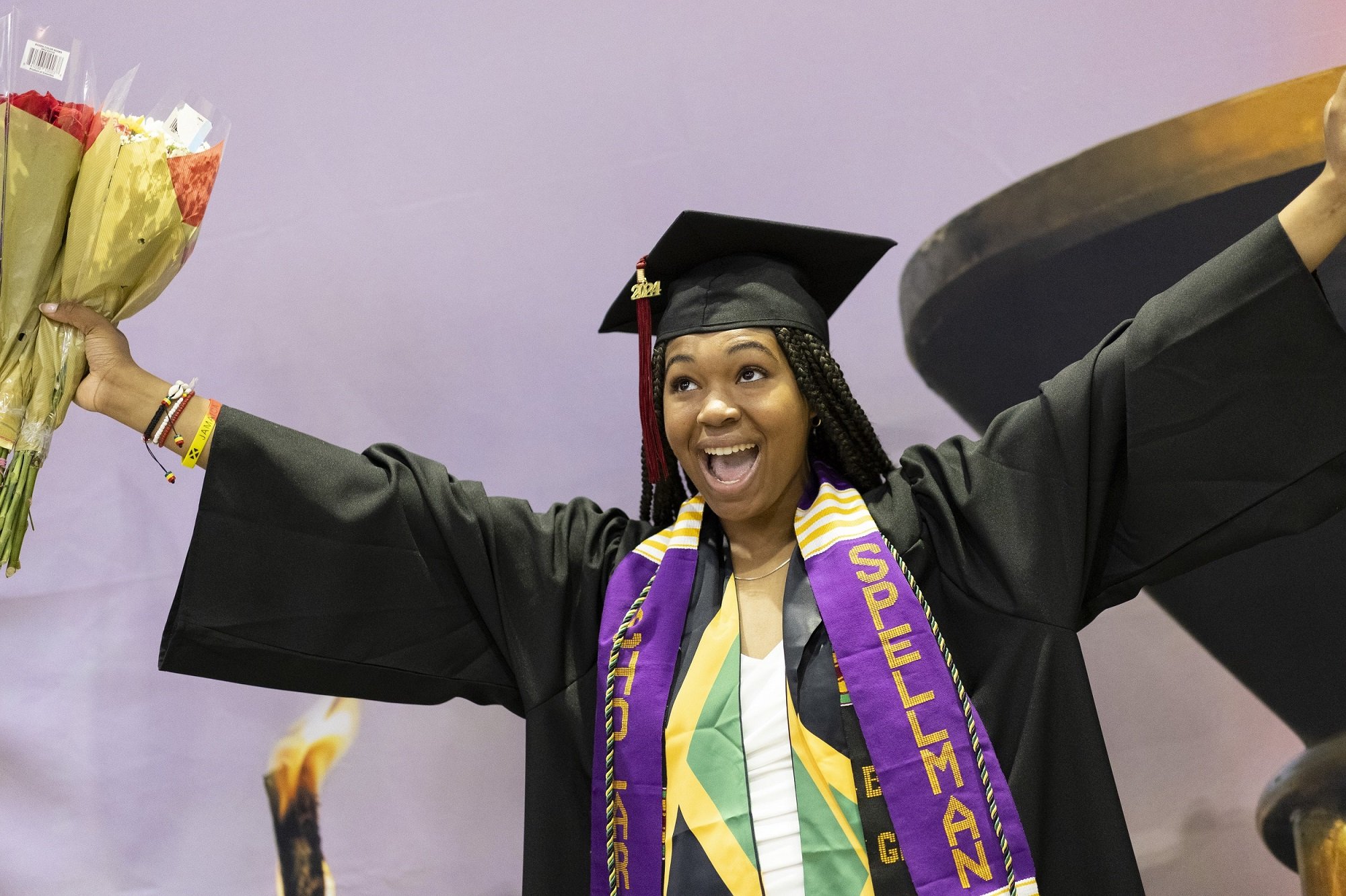 A UAlbany undergraduate student celebrates as she crosses the stage.