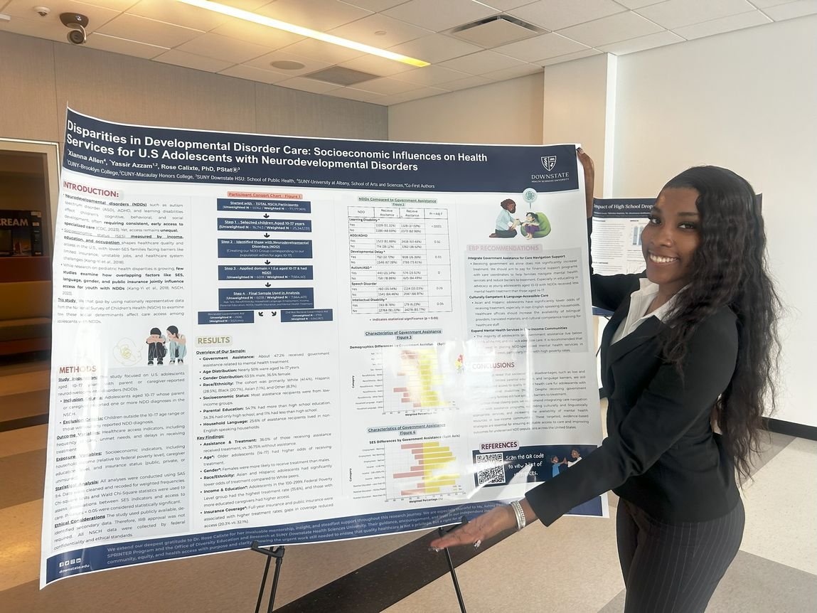 Xianna Allen stands next to her research poster board.