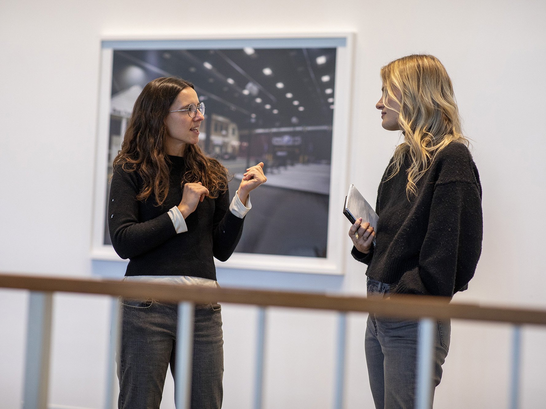 Students discussing artwork