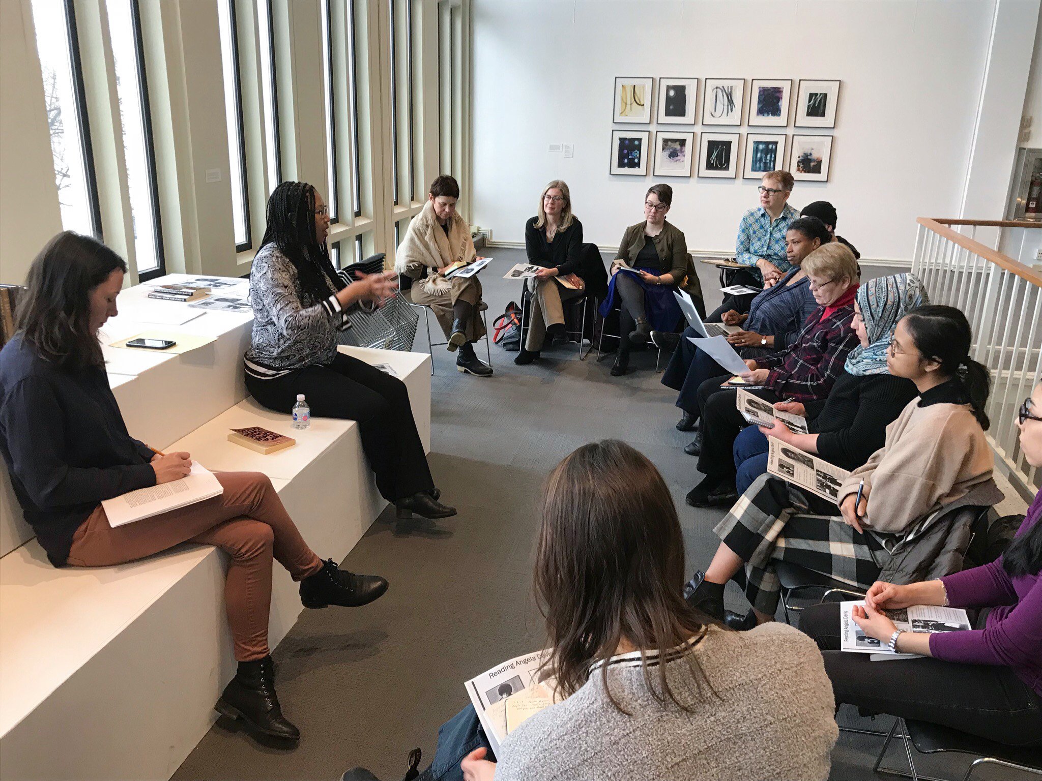 Visitors discussing a book