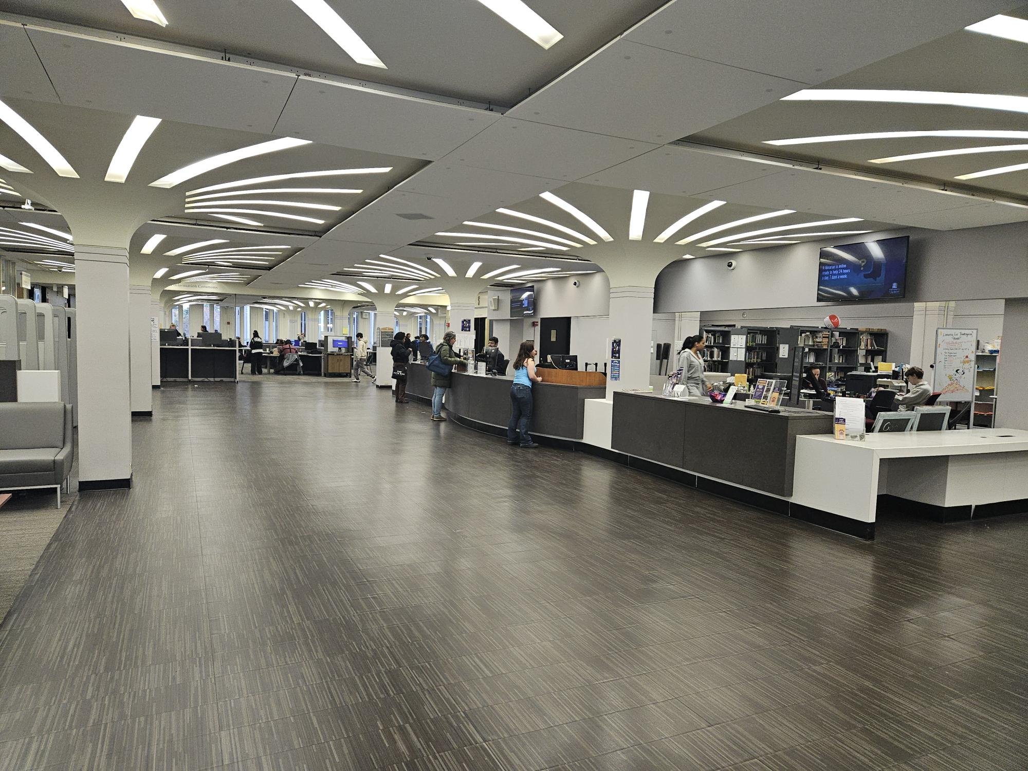 A public facing help desk inside the University Library.