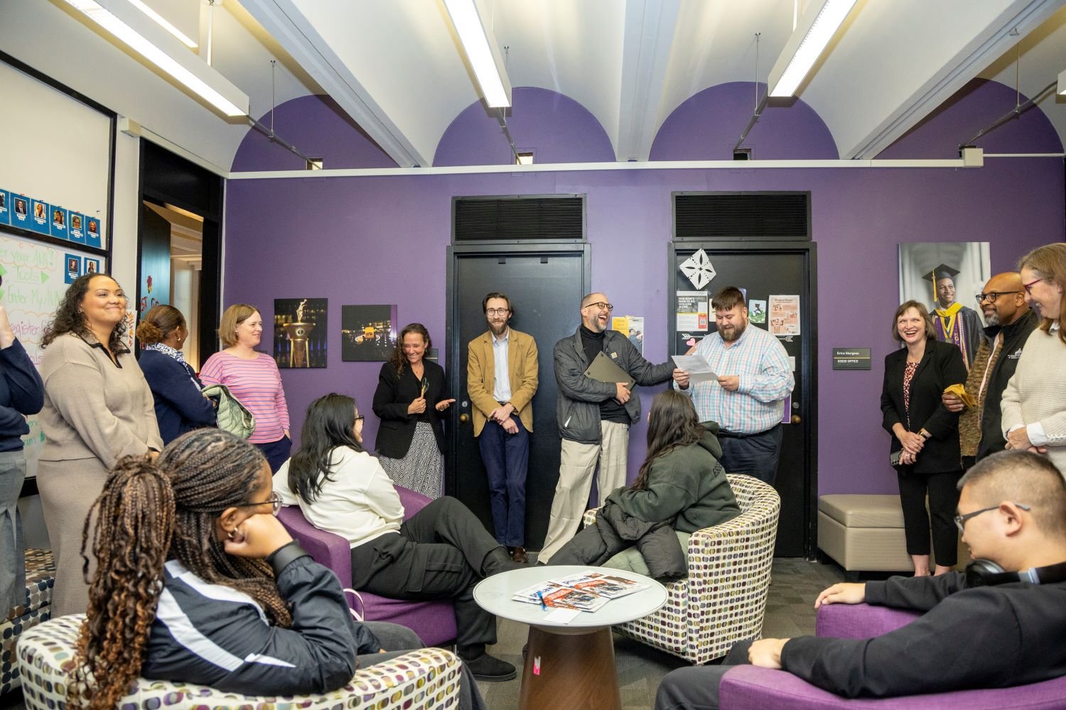 Students, faculty and staff gather for an event to open the new first-gen scholars lounge.