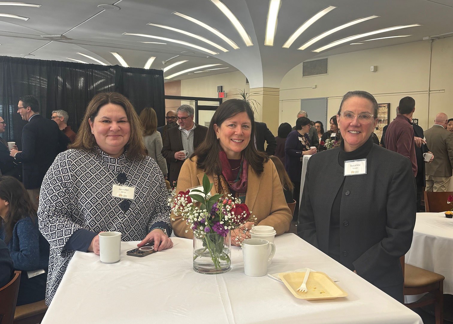 Three faculty and staff donors at the reception.