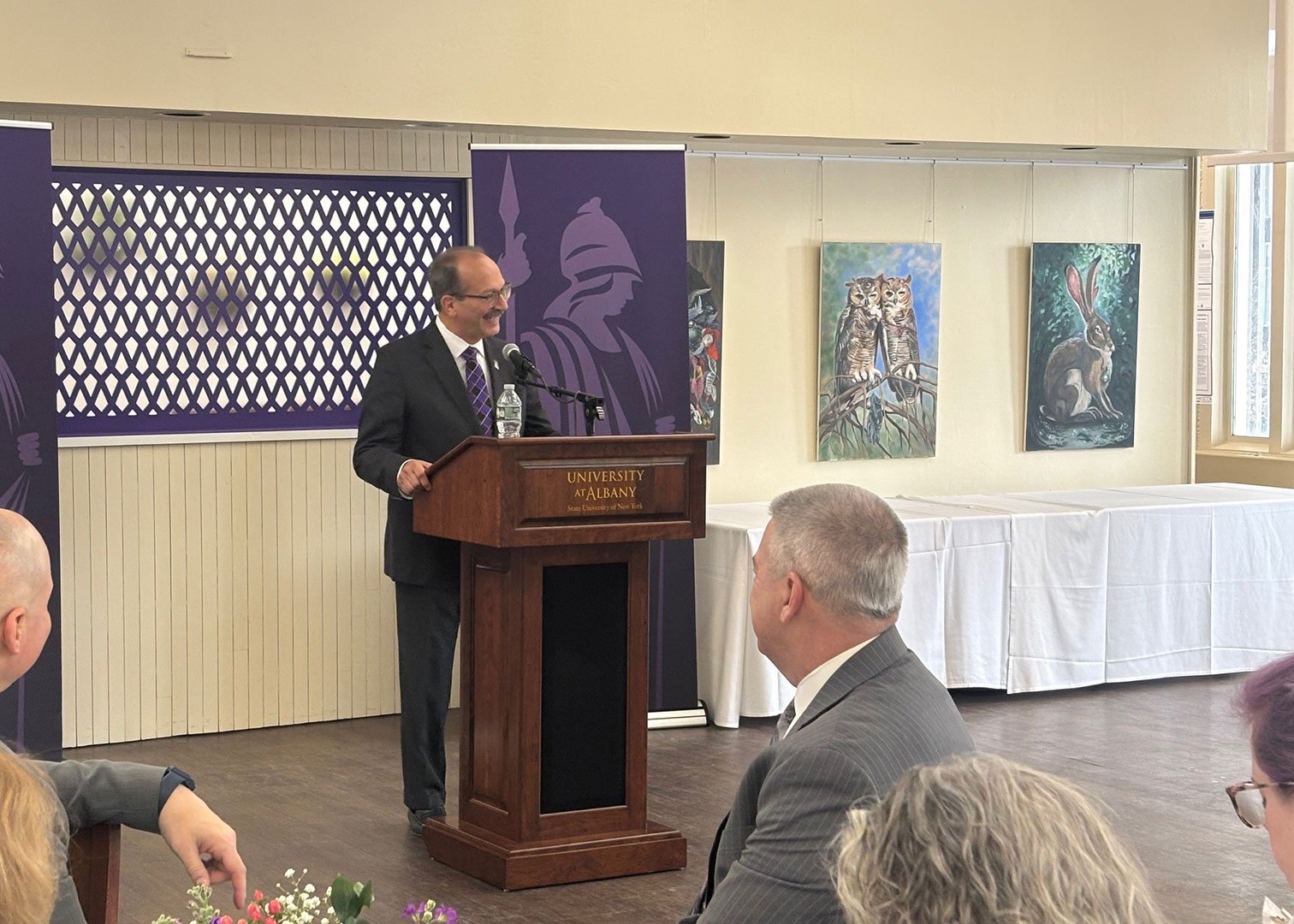 President Rodriguez speaks at the podium during the reception.