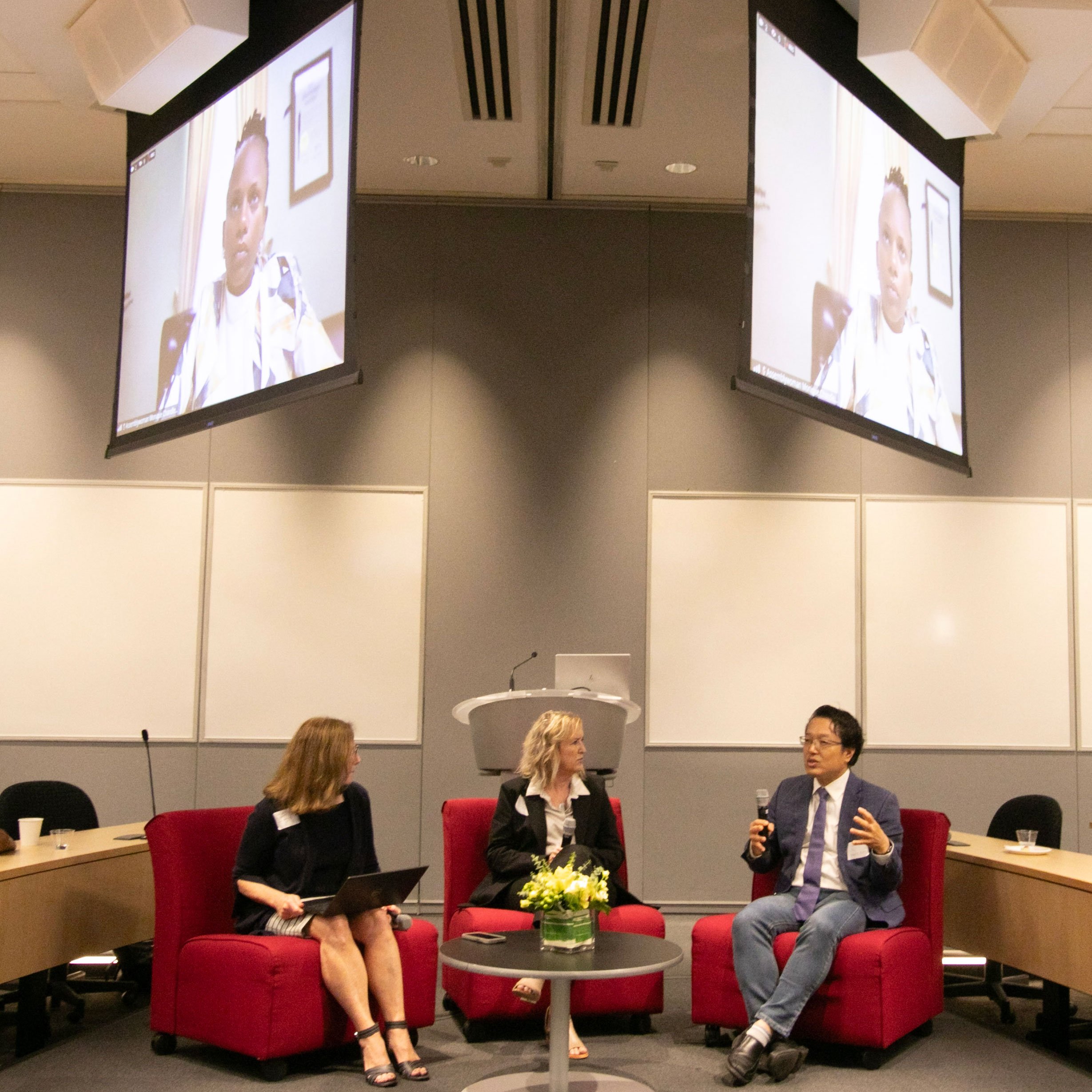 Three speakers sitting at the 2nd Annual Summit for the Global Center in AI Mental Health at the Suny Global Center in NYC.