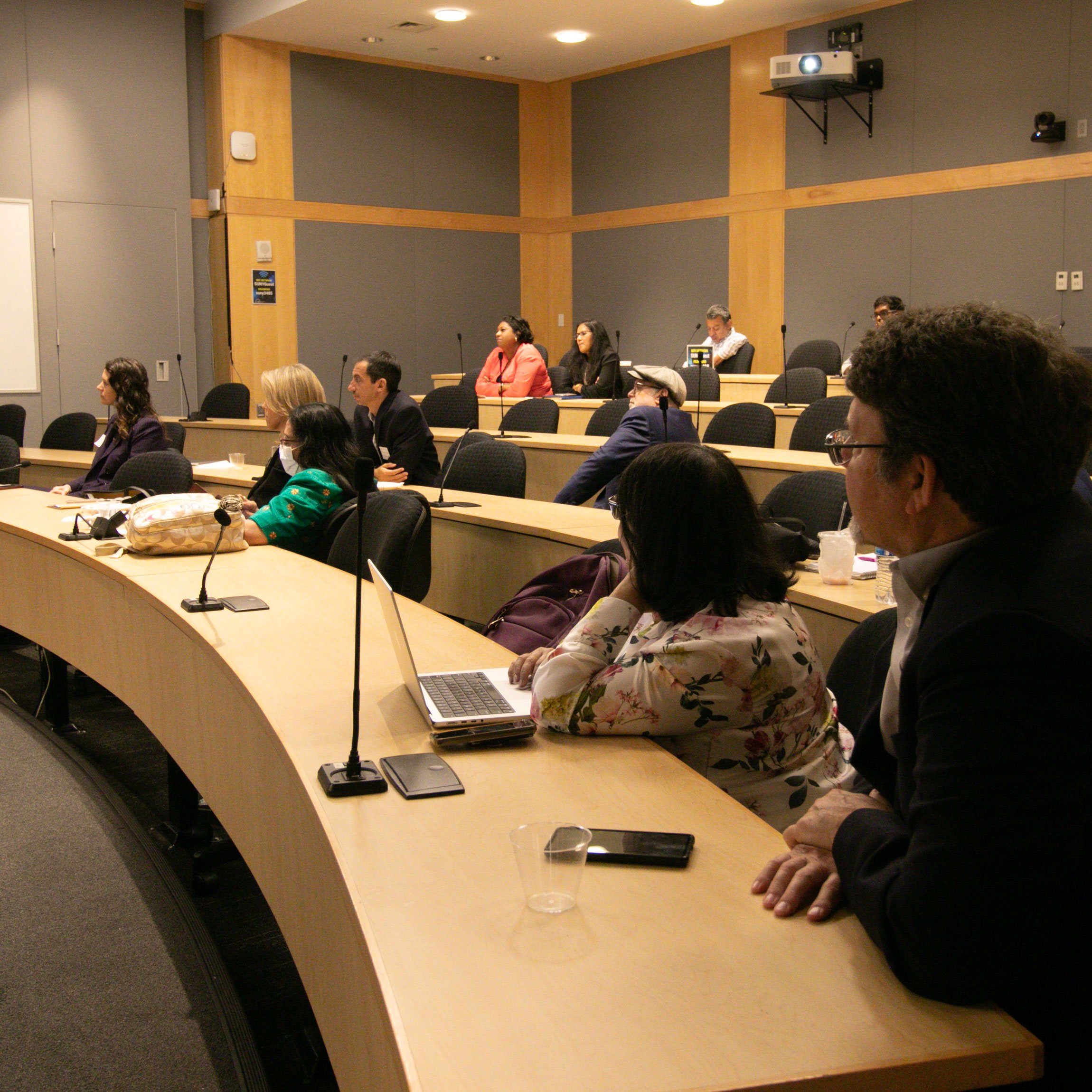 A group of individuals sitting in a seminar at the 2nd Annual Summit for the Global Center in AI Mental Health at the Suny Global Center in NYC.