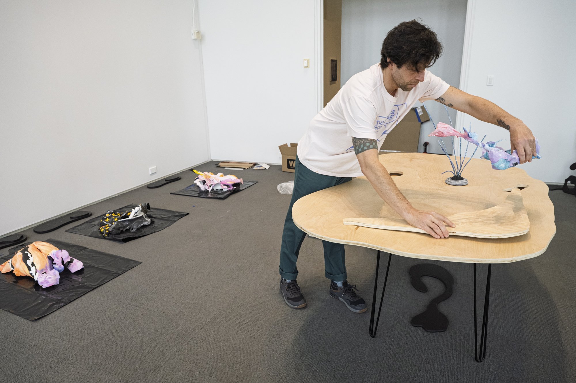 Artist Ira Marcks installing artwork