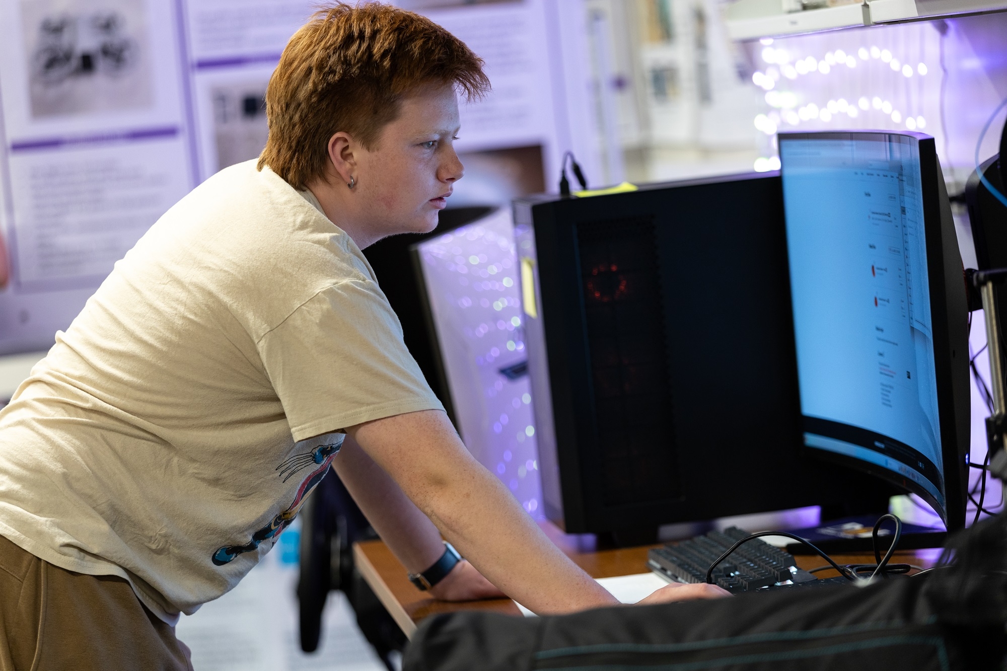 A student reviews a computer screen from inside UAlbany's Mobile Sensor Lab.