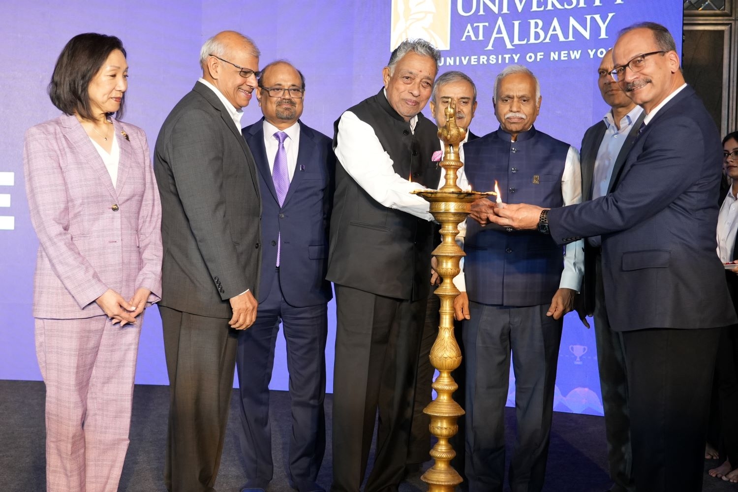 UAlbany and RISM leadership participate in lamp lighting