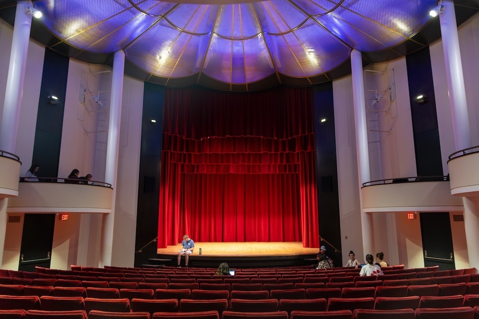 Area high schoolers write inside the Performing Arts Center Recital Hall