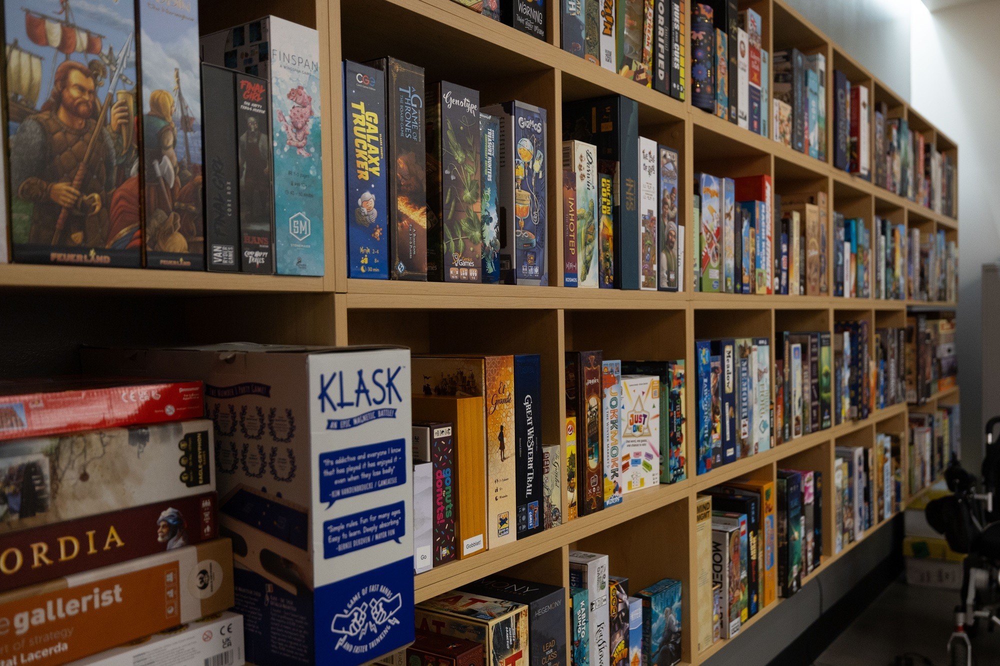 A bookshelf with games is shown in the Game Hub.