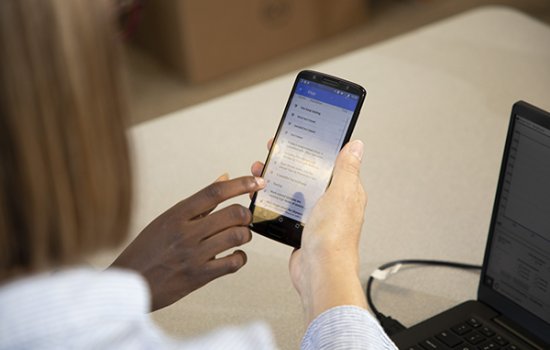 Girls Inc. intern testing an app in development