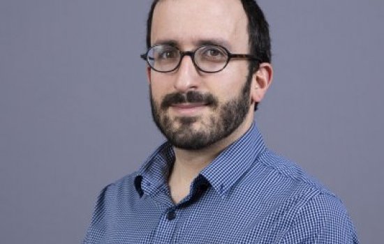 headshot of faculty member Eli Rosenberg