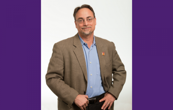 Man smiling at the camera.