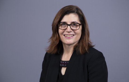 Erin Bell smiles at the camera. 