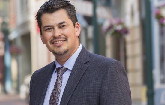 A smiling J. Ramon Gil-Garcia in a suit jacket and tie